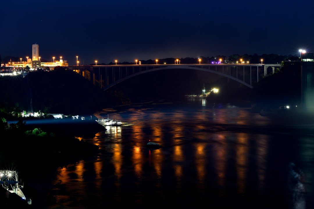 Rainbow Bridge and Niagara Falls skyline illuminated at night